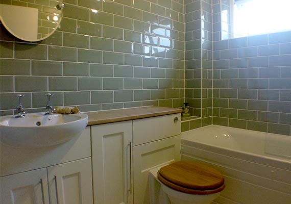 The brief was simple, keep the bathroom looking as classical as possible, from the oak worktop to the exquisitely made taps and sage brickwork tiles.